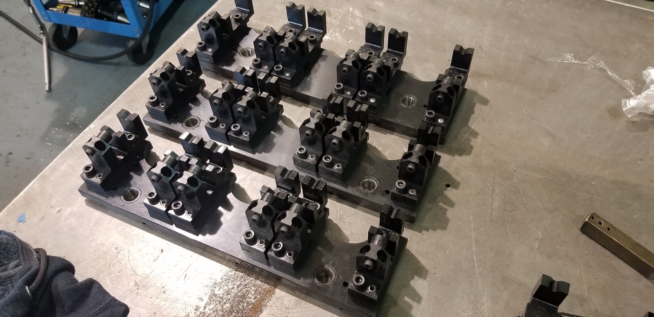 Fixture detail plate with clamp geometry for part-family support.