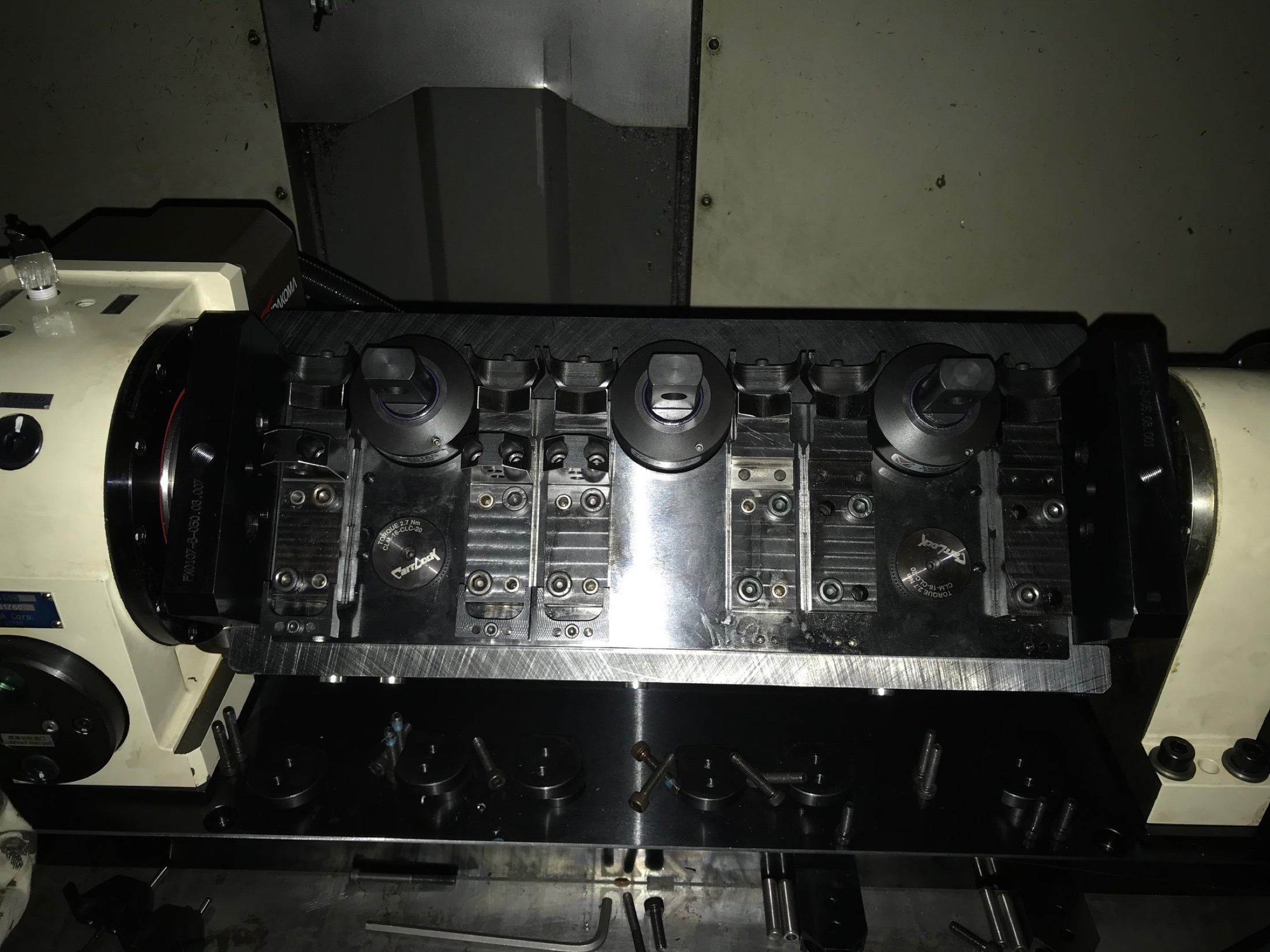 Fixture mounted on rotary table inside machining center.